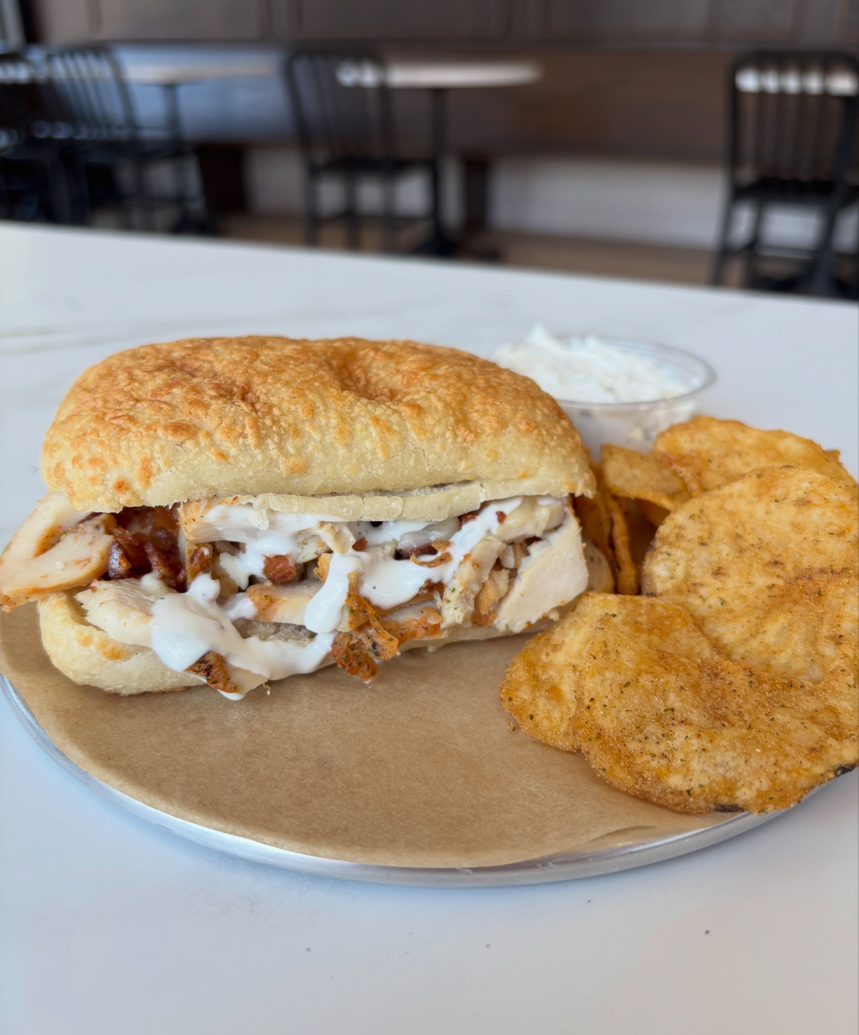 Redbrick chicken, bacon and ranch sandwich served with seasoned chips